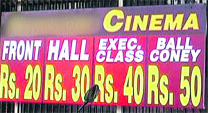 A board put up at the gate of a cinema displaying the new reduced rates of tickets in Amritsar on Sunday.