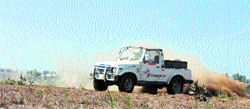 A Gypsy wades through the agricultural fields as a part of the training camp in Ludhiana on Sunday