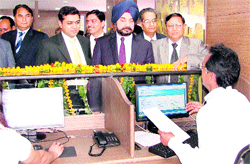 Income Tax Commissioner GS Randhawa (in blue turban) interacts with Aaykar Seva Kendra staff in Ludhianan