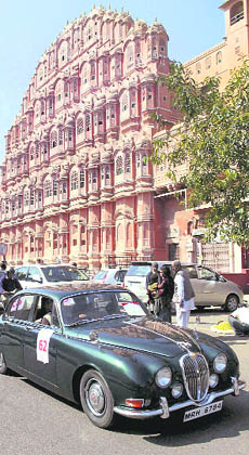 A vintage car passes by the Hawa Mahal during the 13th vintage car rally in Jaipur on Sunday.