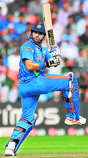 Yuvraj Singh plays a shot during the match against England at the M. Chinnaswamy Stadium in Bangalore on Sunday. Yuvraj scored 58.  AFP