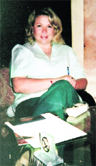 In this undated photo from the Kolotnytska family archive, Libyan dictator Muammar Gaddafis nurse Halyna Kolotnytska poses for photo. 