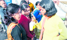 A protester argues with a commuter in Dehradun on Monday. 