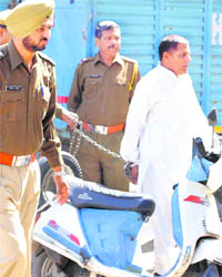 One of those sentenced to death in the Manoj-Babli honour killing case on the way to the District Courts in Karnal on Monday.