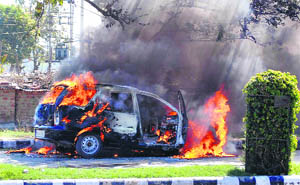 An Indigo car, which caught fire near the mini-secretariat in Karnal on Monday.