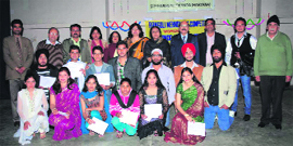 Chief guest Sumita Roy, deputy general manager and head of circle office, Punjab National Bank, Kurukshetra, with the winners of rangoli, modelling and musical chair competitions at Markanda National College, Shahabad-Markanda