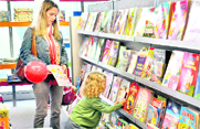This small girl seems to look for something special at a book shop in Gurgaon