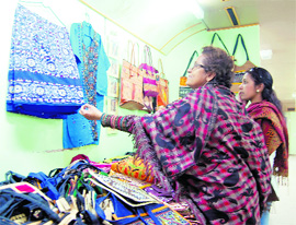 Visitors take a look at artefacts from Shanti Niketan in the exhibition train in Amritsar on Tuesday. Photo: Vishal Kumar