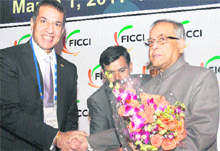 Ficci President Rajan Bharti Mittal welcomes Finance Minister Pranab Mukherjee at the 83rd Annual General Meeting of the chamber in New Delhi on Tuesday. 