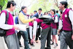 A student touches the feet of his teacher before the board examination at the GSSS-18, Chandigarh, on Tuesday. As many as 14,000 students took the CBSE class XII exam in the city