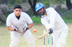 A batsman plays an improvised stroke in a match of the Uttarakhand Cup Beehive Challenger League at Matawala Bagh in Dehradun on Tuesday.