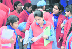 Post-exam blues: Anxious Class XII students coming out of an examination hall in Ludhiana