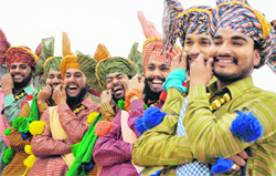 Youth Power: Participants from Chandigarh tweak their moustaches during the Mohinder Singh Dangori Memorial Folk Dance Competition in Ludhiana