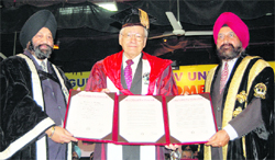 Prof AS Brar, Vice-Chancellor, Guru Nanak Dev University (right), confers the degree of Doctor of Science (honoris causa) on Dr Richard R Ernst, Nobel Laureate (centre), in Amritsar