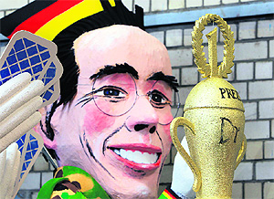 German Defence Minister Karl-Theodor zu Guttenberg is depicted in a papier-mache figure for in Cologne. Guttenberg stepped down on Tuesday after he had admitted copying passages from the work of others in his doctoral dissertation. 