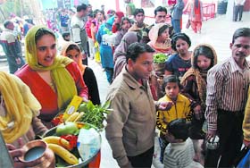 Devotees await their turn to pay obeisance at Pracheen Shiv Temple