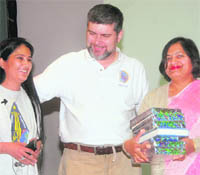 Kalpana Chawla’s husband Jenne Pierre Harrison and her sister donating books to the warden of a girls hostel at PEC University of Technology, Chandigarh.