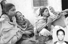 Family members mourn the death of Balwinder Singh (inset) at Damanheri, near Rajpura, on Wednesday.