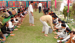 Devotees participate in a bhandara organised on the occasion of Mahashivratri in Gurgaon