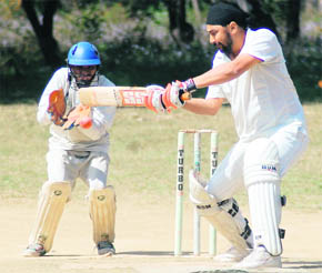 A batsman in action in a match of the Uttarakhand Cup Beehive Challenger League at Matawala Bagh in Dehradun on Wednesday. 