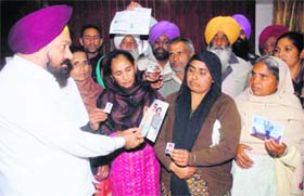 President of the Lok Bhalai Party Balwant Singh Ramoowalia listens to the grievances of members of the families of those stranded in Libya, in Jalandhar