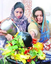 Devotees offer milk and fruits to a Shivlingam on Mahashivaratri at a temple in Bathinda