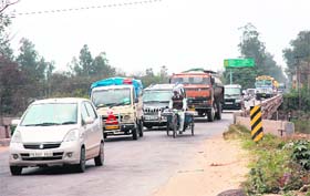 The Kharar-Kurali road with heavy traffic awaits widening
