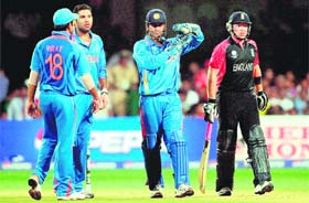 MS Dhoni (2-R) gestures for a review of a not-out decision by the umpire in favour of Englands Ian Bell (R) during their match at The M. Chinnaswamy Stadium in Bangalore on February 27