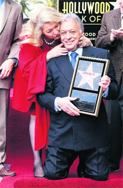 International orchestral and operatic conductor Zubin Mehta gets a kiss from his wife Nancy after Mehta got a star on the Hollywood Walk of Fame in Hollywood on Tuesday.