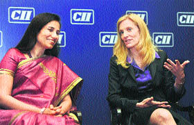 US Under Secretary for International Affairs Lael Brainard (R) talks with CII National Committee chairperson Chanda Kochhar during an interactive session in New Delhi on Thursday. 