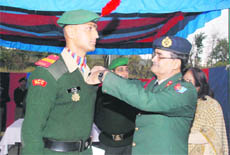 Senior Under Officer Aman Singh being awarded by Brig SN Yadav, Deputy Director General, NCC, at a function in Dehradun on Thursday.