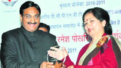 Chief Minister Ramesh Pokhriyal Nishank presents Dr Indu Singh, Principal, MKP Girls College, with a memento in Dehradun on Thursday.
