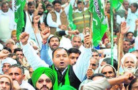 Activists of the INLD hold a protest rally at Parliament Street in New Delhi