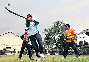 Children enjoy a game of cricket on the NDRI campus in Karnal. 