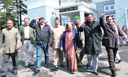 PCC chief Kaul Singh, CLP leader Vidya Stokes along with Congress MLAs stage a walkout from the Assembly in Shimla on Thursday.