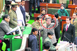 Mohammad Sartaj Madni (encircled), Deputy Speaker of the state Assembly, stages a protest in the House in Jammu