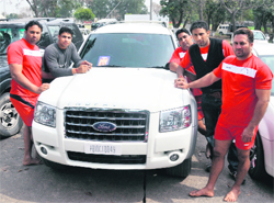 Kabbadi players strike a pose with their SUV in Ludhiana on Thursday