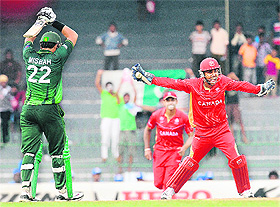 Canadian captain Ashish Bagai (R) celebrates dismissing Pakistan's Misbah-ul-Haq in Colombo on Thursday.