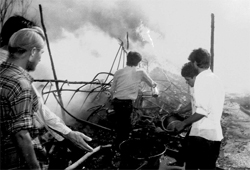 Shopkeepers of the Bajwara rehri market, Sector 22, douse flames after fire broke out in the market