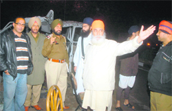 RP Singh, a resident of Phase VII, along with his two sons (standing behind him) was the first one to come to the rescue of the injured trapped in the vehicle. Tribune lensman Vinay Malik captured the images shortly after the mishap.