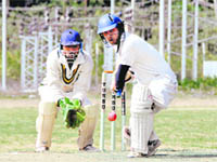 A batsman plays a defensive shot in the first semifinal of the Uttarakhand T20 Cricket League Championship at the Mahendra Grounds in Dehradun on Friday.