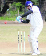 A batsman plays a shot in the Beehive Challenge Cricket Tournament at Matawala Bagh grounds in Dehradun on Friday.