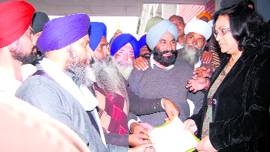 Members of Sikh organisations submit a memorandum to ADC Pankaj Chaudhary at Sirsa on Friday.