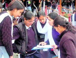 Students of Class XII discuss question paper on the first day of the HPSEB examination in Dharamsala on Friday