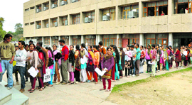 Students queue up for the attestation of re-evaluation forms of different examinations in the University of Jammu.