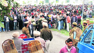 Workers and textile industrialists protest outside the central excise office in Ludhiana against the proposal of 10 per cent excise duty to be imposed on them.