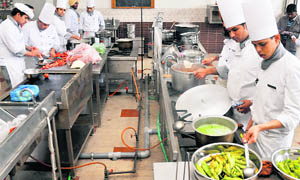 Students prepare cuisines at the PCTE Institute of Hotel Management on Friday.