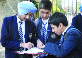Students of Class X discuss their paper appeared in the CBSE board examination at Modern School in New Delhi