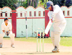 A batsman gets bowled in a match of the 60th District Cricket League at the Survey of India stadium in Dehradun on Saturday.