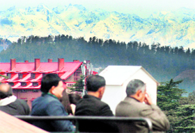 People enjoy a sunny day in Shimla on Saturday.